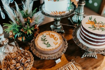 Canvas Print - A closeup of a festive table with a variety of sweets and snacks served during the ceremony