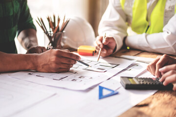 Wall Mural - construction and engineer structure concept of engineer working drawing on blueprint meeting for pro