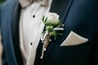 Smartly dressed person at wedding wearing a suit and a coordinating bow tie with flowers in a pocket