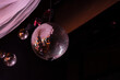 Three typical dance club mirror balls