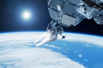 Wall Mural - an astronaut in outer space, on the station. elements of this image furnished nasa.