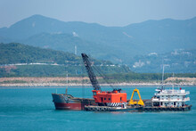 Floating Crane Working As A Dredger Near Chinese Sea Coast.