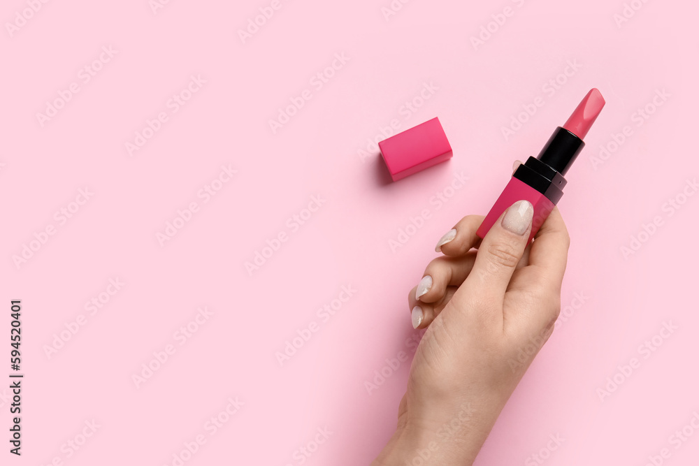 Woman with lipstick on pink background