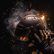 Helmet helmet in hands in sparks and smoke
