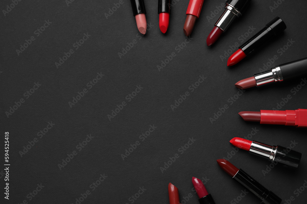 Composition with beautiful lipsticks on dark background