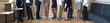 © Studio Romantic - Group of people standing in office. Team of men and women standing in office, discussing work, waiting for start of business meeting. Human legs, cropped shot, low section. Banner, header background