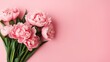 pink peony roses and sprinkles on isolated pastel pink background with blank space