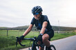 © Azeemud-Deen Jacobs/peopleimages.com - Sports, nature and female athlete cycling on a bicycle training for a race, marathon or competition. Fitness, workout and woman cyclist riding bike for cardio exercise on outdoor road in the mountain