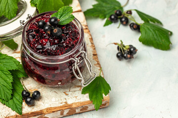 Wall Mural - The black currant curd, custard or jam and fresh berries, Food recipe background. Close up