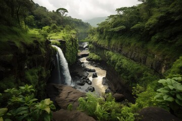 Wall Mural - view of canyon with rushing waterfall, surrounded by lush greenery, created with generative ai