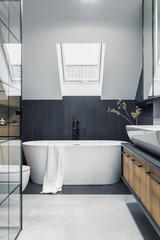 Poster - Stylish interior of bathroom with bathtub, shower, towels and other personal bathroom accessories. Modern and design interior concept. Roof window. Template.