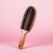 wooden hairbrush isolated on pink studio background, made with generative ai