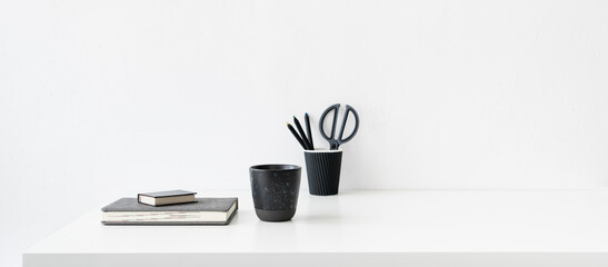 Sticker - Office table, empty desk with supplies and white wall copy space..