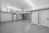 Fototapeta  - Interior view of an empty garage with a metallic surface floor and lighting