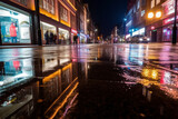 Fototapeta Londyn - night treet with wet road and colorfuil building