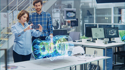 Wall Mural - engineering facility: female designer with chief engineer use smartphone with augmented reality app 