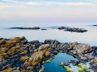 Wall Mural - Breathtaking landscape of a vast blue ocean with a dramatic sky in the background in Bornholm island