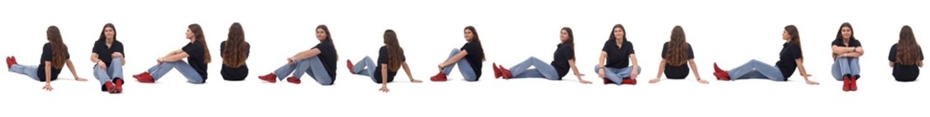 Wall Mural - line of a large group of same young girl sitting on the floor on white background