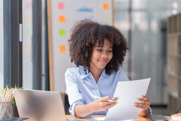 portrait of Beautiful Asian African businesswoman with smiling working in the office.