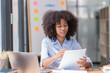 © Tj - portrait of Beautiful Asian African businesswoman with smiling working in the office.