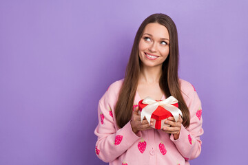 Sticker - Photo of dreamy pretty lady dressed strawberry print cardigan holding present box looking empty space isolated purple color background