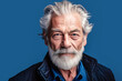 © ADDICTIVE STOCK - Generative AI illustration with portrait of confident senior man with gray hair looking at camera against blue background in studio