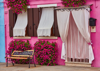 Wall Mural - Front of the pink house on the island of Burano, Venice