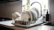 © bahadirbermekphoto - Dish drying rack with different clean plates Generated AI