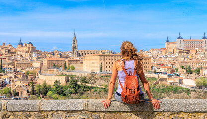 Wall Mural - Woman tourist in Toledo city landscape panoramic view in Spain- Travel in Europe