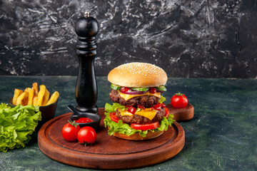 Wall Mural - Tasty homemade sandwich tomatoes pepper on wooden board on dark color background