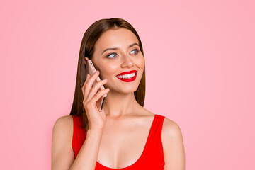 Sticker - Close up portrait of charming and lovely girl with bright red lipstick on her lips talking on the phone on vacation isolated on yellow background