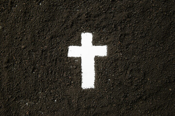 Wall Mural - top view of white cross shape with dark soil grim reaper death