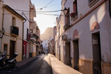 Fototapeta Uliczki - View of colorful buildings and narrow streets, architecture in the historic center of the Mediterranean town of Calpe. Region Valencia in Spain
