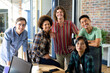 © Wavebreak Media - Group portrait of happy diverse creative team smiling in casual office