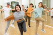 © JackF - Energetic teenagers formed pairs and dancing swing in studio.