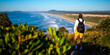© Jakub - beautiful backpacker girl enjoying spectacular view of new south wales coast in hat head national park, australia; sand dunes and long beach on the shore of pacific during sunrise