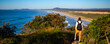 © Jakub - beautiful backpacker girl enjoying spectacular view of new south wales coast in hat head national park, australia; sand dunes and long beach on the shore of pacific during sunrise