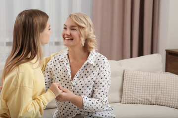 Canvas Print - Young woman with her mom at home. Happy Mother's Day