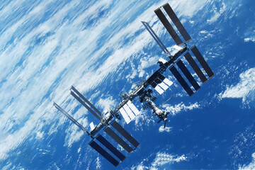 Wall Mural - International Space Station above the Earth. Elements of this image furnished by NASA