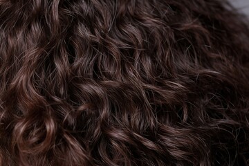 Frizzy textured dark brown hair. Generative AI.