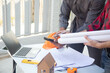© weerachai - Team Architect planing and discuss at Construction Site with blueprint