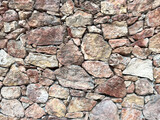 Fototapeta Desenie - Old stone wall background texture. Close up shot. Brick wall pattern.