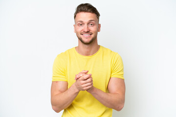 Wall Mural - Young blonde caucasian man isolated on white background laughing