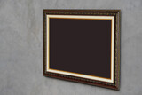 Fototapeta  - brown paper on brown and gold rectangle frame on cement wall background, object, decor, fashion, gift, photo, banner, template, copy space