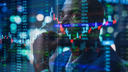 portrait of black stock market trader doing analysis of investment charts, graphs, ticker numbers pr
