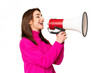 © luismolinero - Young caucasian woman over isolated chroma key background shouting through a megaphone