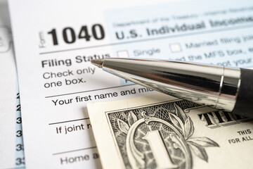 Wall Mural - Tax Return form 1040 and dollar banknote, U.S. Individual Income.
