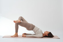 Flexible Female Practicing Bridge Pose During Yoga