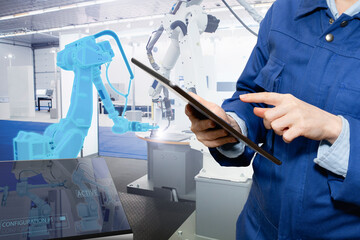 Poster - Engineer uses a digital tablet to control robots in a smart factory. Smart industry 4.0 concept	