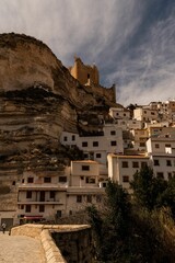 Canvas Print - Picturesque view of Alcala del Jucar village in Spain bathed in a natural warm light